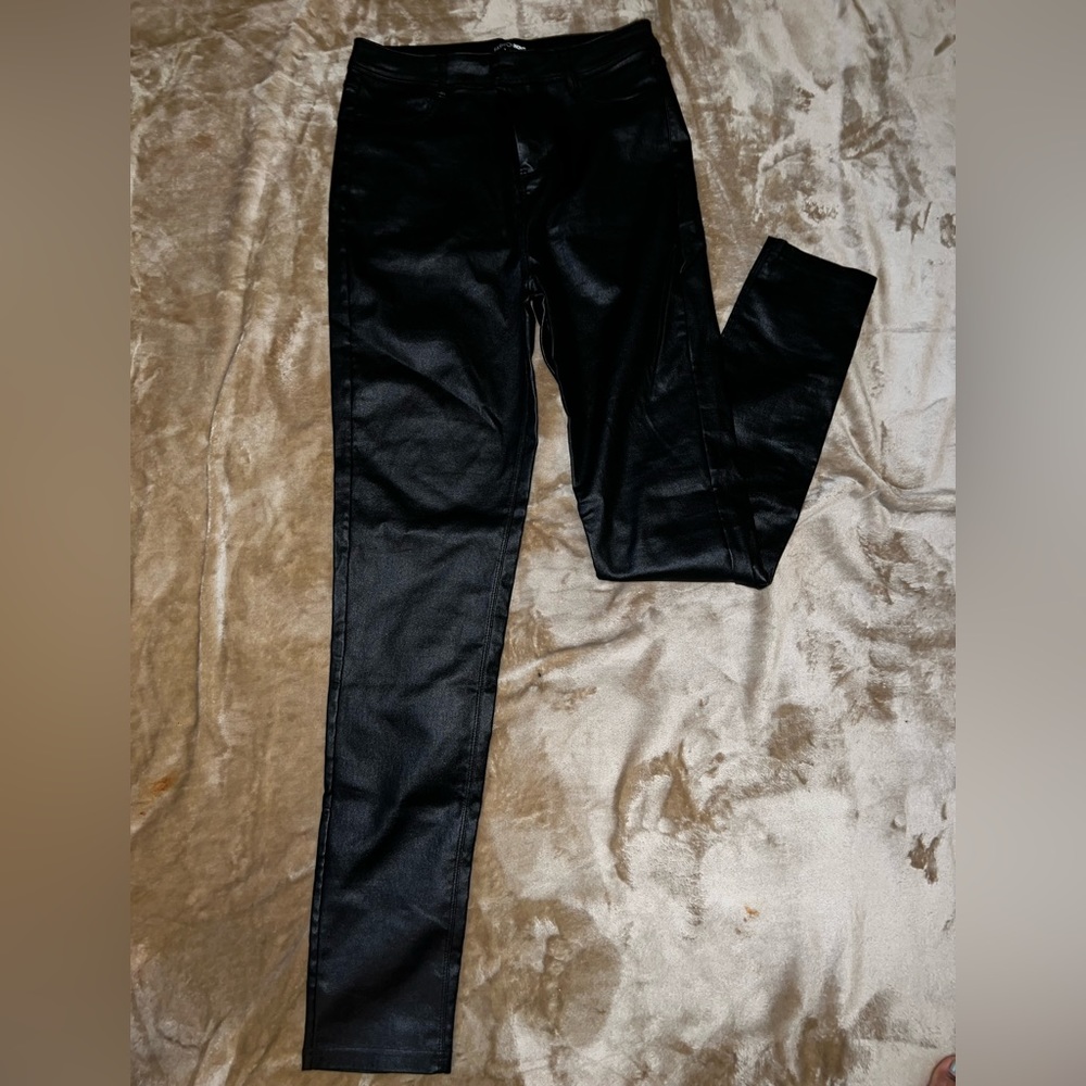 These are black, faux leather size Large Fashionova skinny fit  pants.